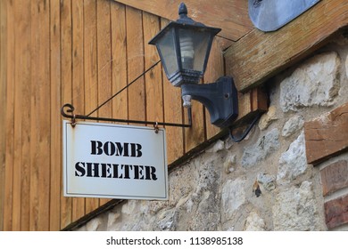 Bomb Shelter Sign Hanging On The Wall