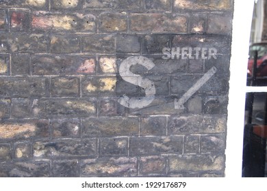 A bomb shelter sign from World War II on a wall in Lord North Street in Westminster, London, UK