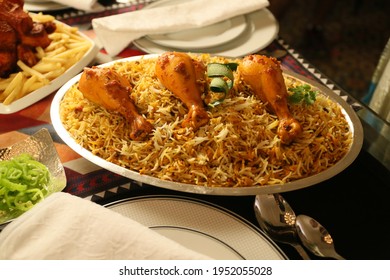 of bombay biryani in silver plate, Traditional spicy indian food, Iftar meal, Ramadan dinner on white background.
