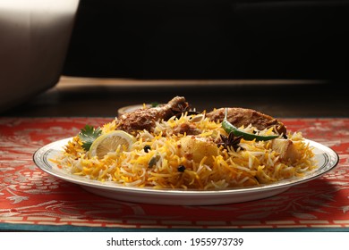 bombay biryani in white plate, Traditional spicy indian food, Iftar meal, Ramadan dinner on white background.
