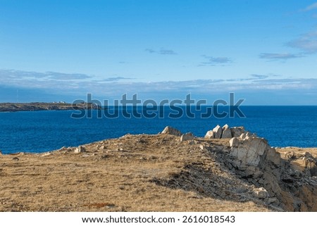 Bonavista, Newfoundland, Canada. Dungeon Provincial Park UNESCO Geosite. Blue sky, clouds. Dungeon Road Beach, the jaggy coast. Tourist attractions, geological wonders. 