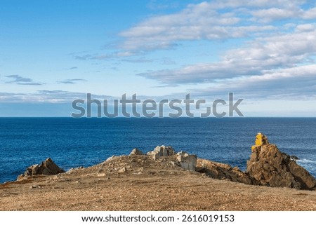 Bonavista, Newfoundland, Canada. Dungeon Provincial Park UNESCO Geosite. Blue sky, clouds. Dungeon Road Beach, the jaggy coast. Tourist attractions, geological wonders. 