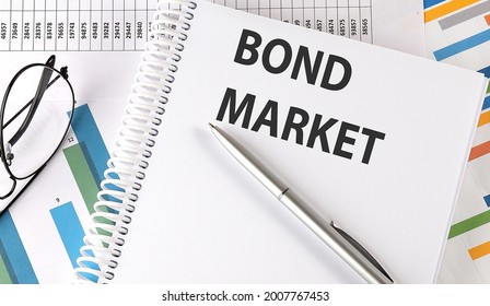BOND MARKET text , pen and glasses on chart - Shutterstock ID 2007767453