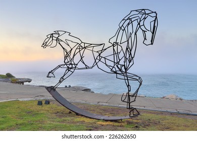 BONDI, AUSTRALIA -  OCTOBER 25, 2014; Sculpture By The Sea Annual Free Public  Event 2014.  A Sea Fog Rolls In Behind The Sculpture Titled Which Way Forwards By  Harrie Fasher, NSW.   