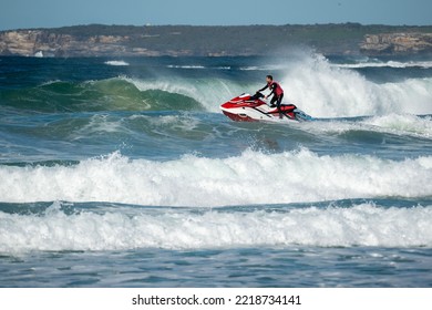 BONDI BEACH, AUSTRALIA - Jul 23, 2022: A Surf Rescue Team Heading Out Into The Ocean To Rescue A Person In Australia