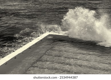 Bondi Beach, New South Wales. Sea Waves crushing on the famous pools along the ocean on a stormy morning. - Powered by Shutterstock