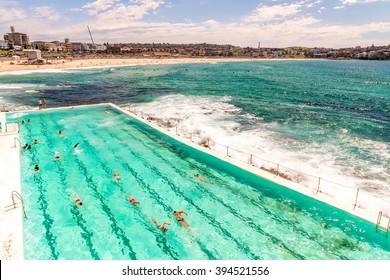 Bondi Beach, Sydney. Ocean With With People Swimming.