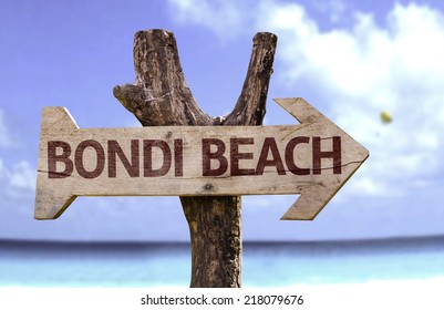 Bondi Beach Wooden Sign With A Beach On Background