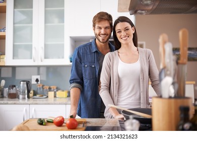 Bonding Over Date Night. A Young Couple Making Dinner Together At Home.