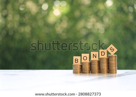 Bonds word on stack of coins money on natural green background, Investments and Bonds increasing concept