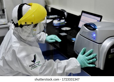 Bone Bolango, Gorontalo/Indonesia - April 24, 2020 : A Man Tests Covid-19 Specimens With Real Time Polymerase Chain Reaction Shooting In The Indonesian Food And Drug Administration, Gorontalo