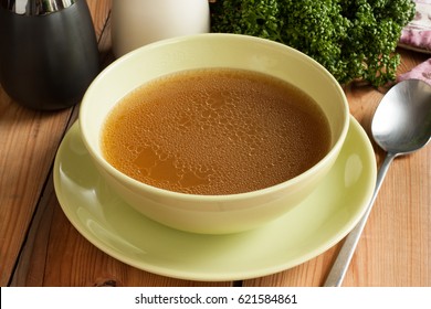 Bone Broth Made From Beef, Served In A Green Soup Bowl