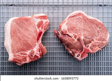 Bone In Center Cut Loin Pork Chops On A Metal Tray