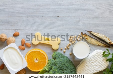 Bone shaped cheese and bone strengthening foods products, concept osteoporosis and prevention Foto stock © 