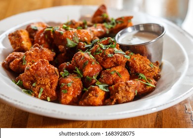 Boneless Buffalo Wings With Sauce In Bowl