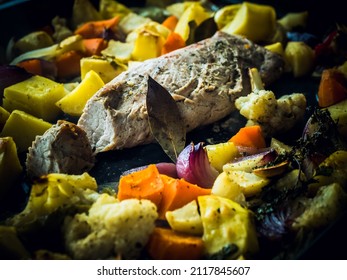 Boneless Pork Leg Cooked With Vegetables, Closeup View. Preparing Pork Leg With Vegetables And Red Wine In The Pan.