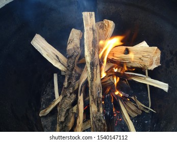 Bonfire Is Bred In A Black Yuochka. Wooden Bars Burn In The Oven.