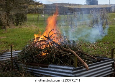 Bonfire Clearing Up After Storm Damage Rubbish