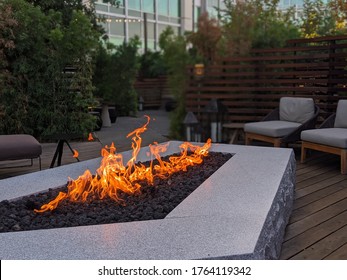 Bonfire and fire pit by rustic lounge in California