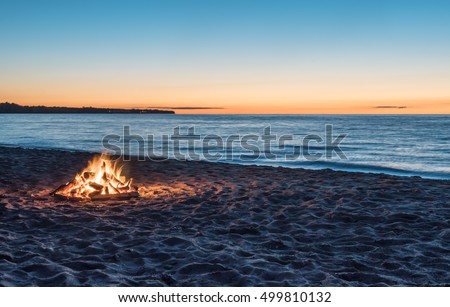 Bonfire on the Beach at Sunset