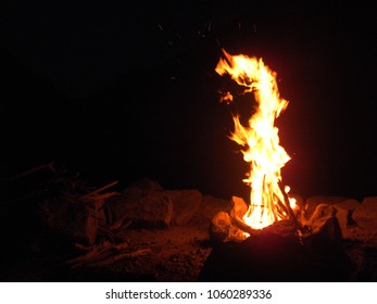 Bonfire at the top of a rocky mountain - Powered by Shutterstock