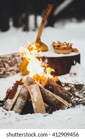 Bonfire In Winter Forest