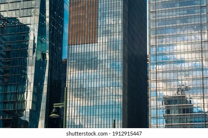 Bonifacio Global City, Taguig, Metro Manila - Feb 2021: The Glass Cladding Of Office Towers Reflect A Beautiful Afternoon Sky.