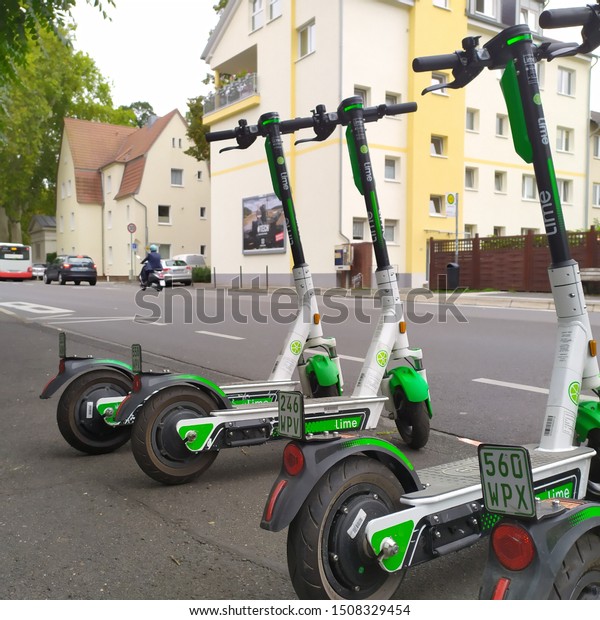 Bonn Germany, 17 Sept. 2019: Lime Electric Riders Parked\
On Sidewalk 