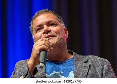 BONN, GERMANY - MAY 19th 2018: Aaron Douglas (*1971, Canadian Actor, Battlestar Galactica) Talks About His Experiences In Battlestar Galactica At Fedcon 27, A Four Day Sci-fi Fan Convention