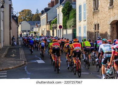 Bonneval, France - October 10, 2021: Rear View Of The Peloton Riding In Bonneval During Road Cycling Race Paris-Tour 2021.