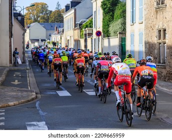 Bonneval, France - October 10, 2021: Rear View Of The Peloton Riding In Bonneval During Road Cycling Race Paris-Tour 2021.