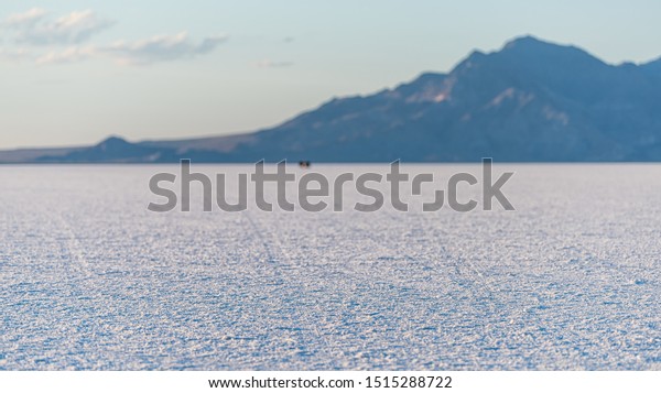 Bonneville\
Salt Flats panorama of landscape near Salt Lake City, Utah and\
mountain view during sunset and sand\
texture