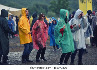 BONTIDA, ROMANIA - JULY 16, 2016: People living heavy rainy days at Electric Castle Festival. After 3 days of raining the area of the festival became extremly muddy and wet
