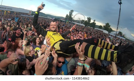 BONTIDA, ROMANIA - JULY 22, 2018: Singer Of Dubioza Kolektiv Band Doing A Crowd Surfing During Their Concert At Electric Castle Festival