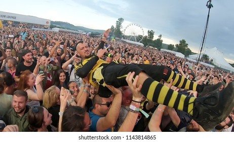 BONTIDA, ROMANIA - JULY 22, 2018: Singer Of Dubioza Kolektiv Band Doing A Crowd Surfing During Their Concert At Electric Castle Festival