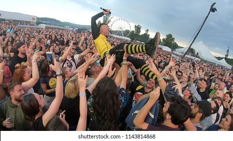 BONTIDA, ROMANIA - JULY 22, 2018: Singer Of Dubioza Kolektiv Band Doing A Crowd Surfing During Their Concert At Electric Castle Festival