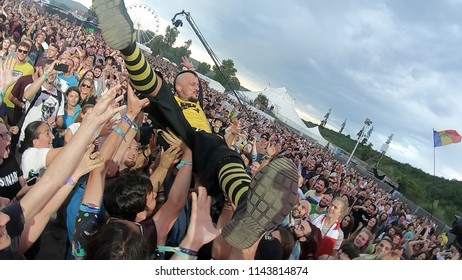 BONTIDA, ROMANIA - JULY 22, 2018: Singer Of Dubioza Kolektiv Band Doing A Crowd Surfing During Their Concert At Electric Castle Festival