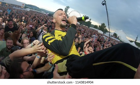 BONTIDA, ROMANIA - JULY 22, 2018: Singer Of Dubioza Kolektiv Band Doing A Crowd Surfing During Their Concert At Electric Castle Festival