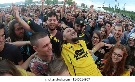 BONTIDA, ROMANIA - JULY 22, 2018: Singer Of Dubioza Kolektiv Band Doing A Crowd Surfing During Their Concert At Electric Castle Festival