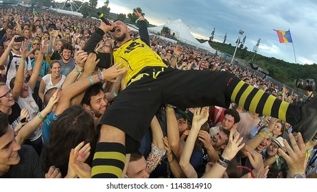 BONTIDA, ROMANIA - JULY 22, 2018: Singer Of Dubioza Kolektiv Band Doing A Crowd Surfing During Their Concert At Electric Castle Festival