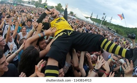 BONTIDA, ROMANIA - JULY 22, 2018: Singer Of Dubioza Kolektiv Band Doing A Crowd Surfing During Their Concert At Electric Castle Festival