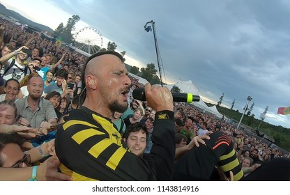 BONTIDA, ROMANIA - JULY 22, 2018: Singer Of Dubioza Kolektiv Band Doing A Crowd Surfing During Their Concert At Electric Castle Festival