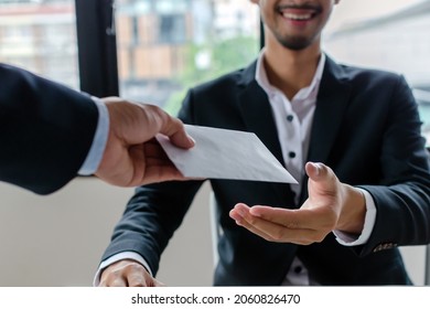 Bonus. boss giving money bonus in paper envelope to business man worker employee for increasing of salary or promotion new position in meeting room office, unemployment, business company concept