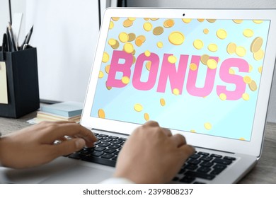 Bonus gaining. Woman using laptop at table, closeup. Illustration of falling coins and word on device screen