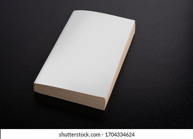 Book with blank cover on black background, editable mock up template ready for your design, clipping path included