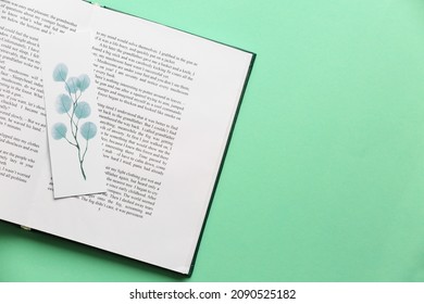 Book with bookmark on color background