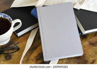 Book Cover Mock Up - Plain White Book Against Other Books In Canvas Tote, Concept For Book Club, Reading List Or Author New Release Mockup 