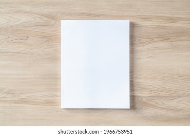 Book Cover Mockup With Blank White Front Paper Page A4 Paperback Mock Up For Catalog, Magazine, Menu, Booklet, Notebook, Portfolio Design Template On Wood Table Background 