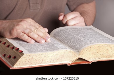 Book (Dictionary) with hands