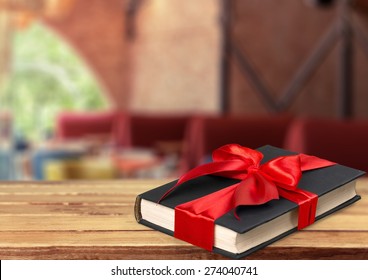 Book, gift, bow.